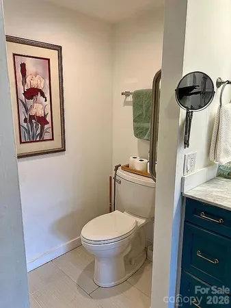 a bathroom with a toilet and a sink