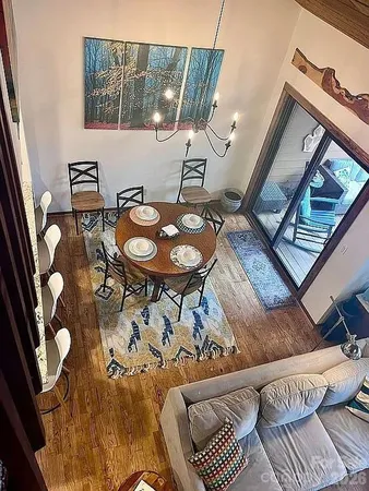 view of a room that has a table and chairs