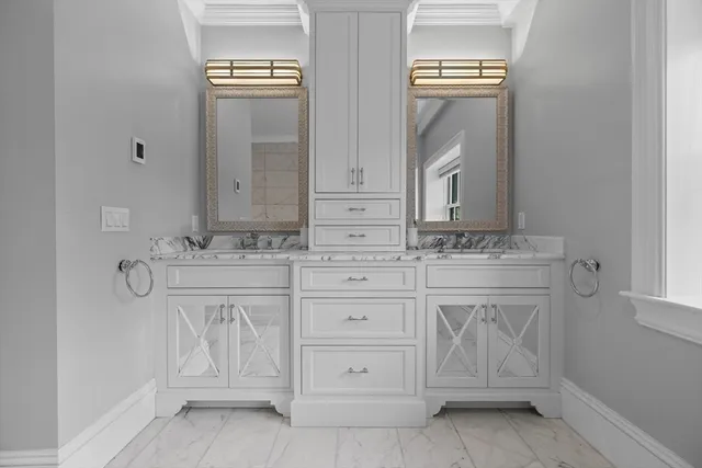 a bathroom with a sink a vanity and a mirror