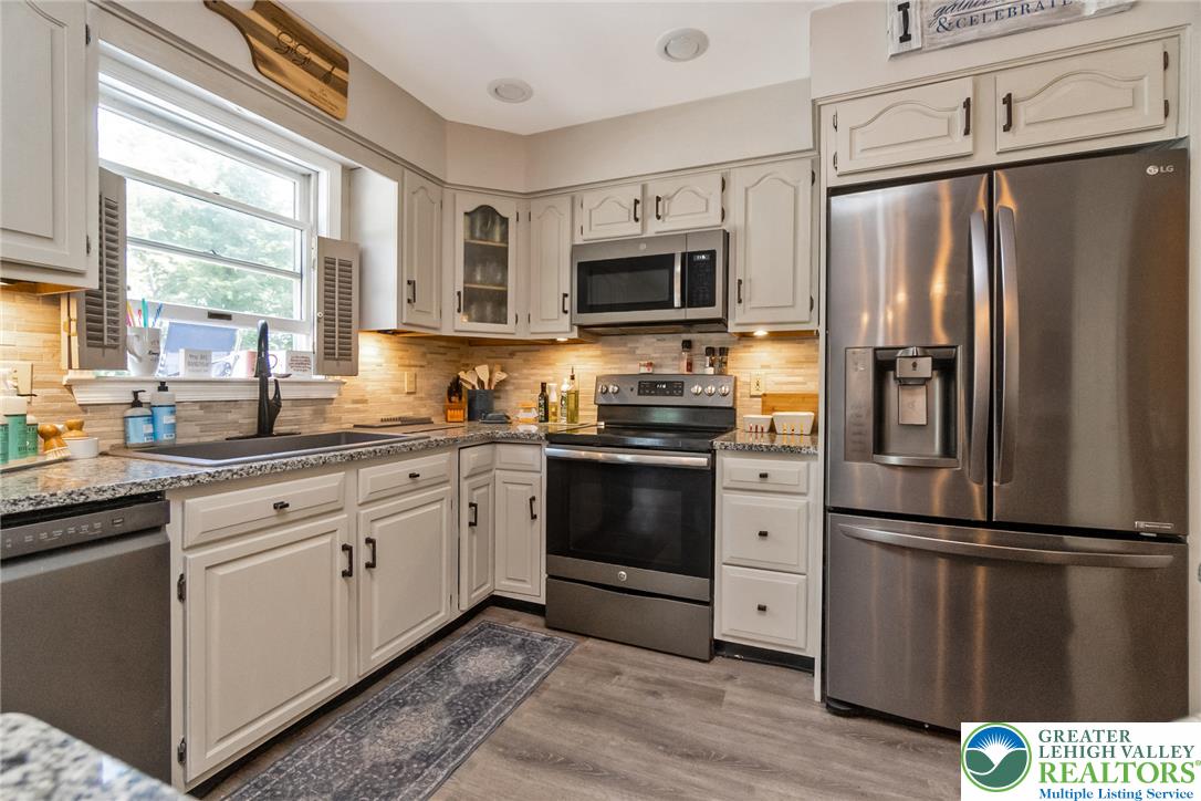 9461 Red Road Kempton, PA 19529 - Photo 7 of 55 A well-appointed kitchen showcasing contemporary appliances and ample cabinetry.