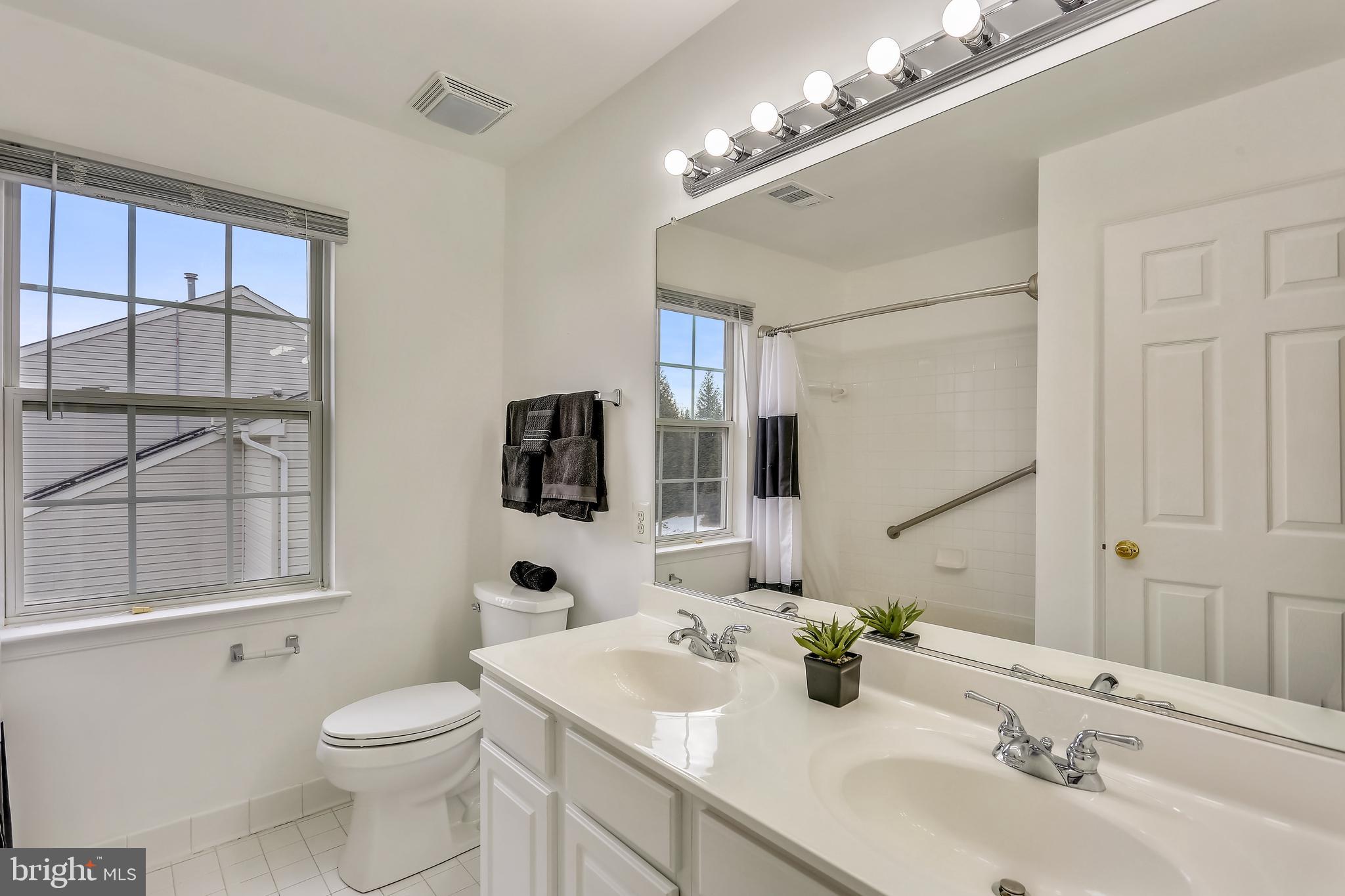 18519 Cornflower Road Boyds, MD 20841 - Photo 19 of 35 Hall Full Bath with Double vanity & tiled floors