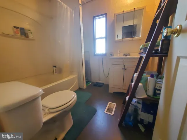 a kitchen with a sink and a refrigerator