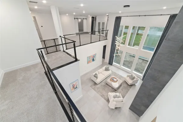 a view of living room with furniture and floor to ceiling window