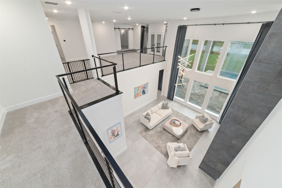 29627 Cir S Rnch Trail Fulshear, TX 77406 - Photo 11 of 50 Overlook that keeps the home connected while still giving each space its own identity.