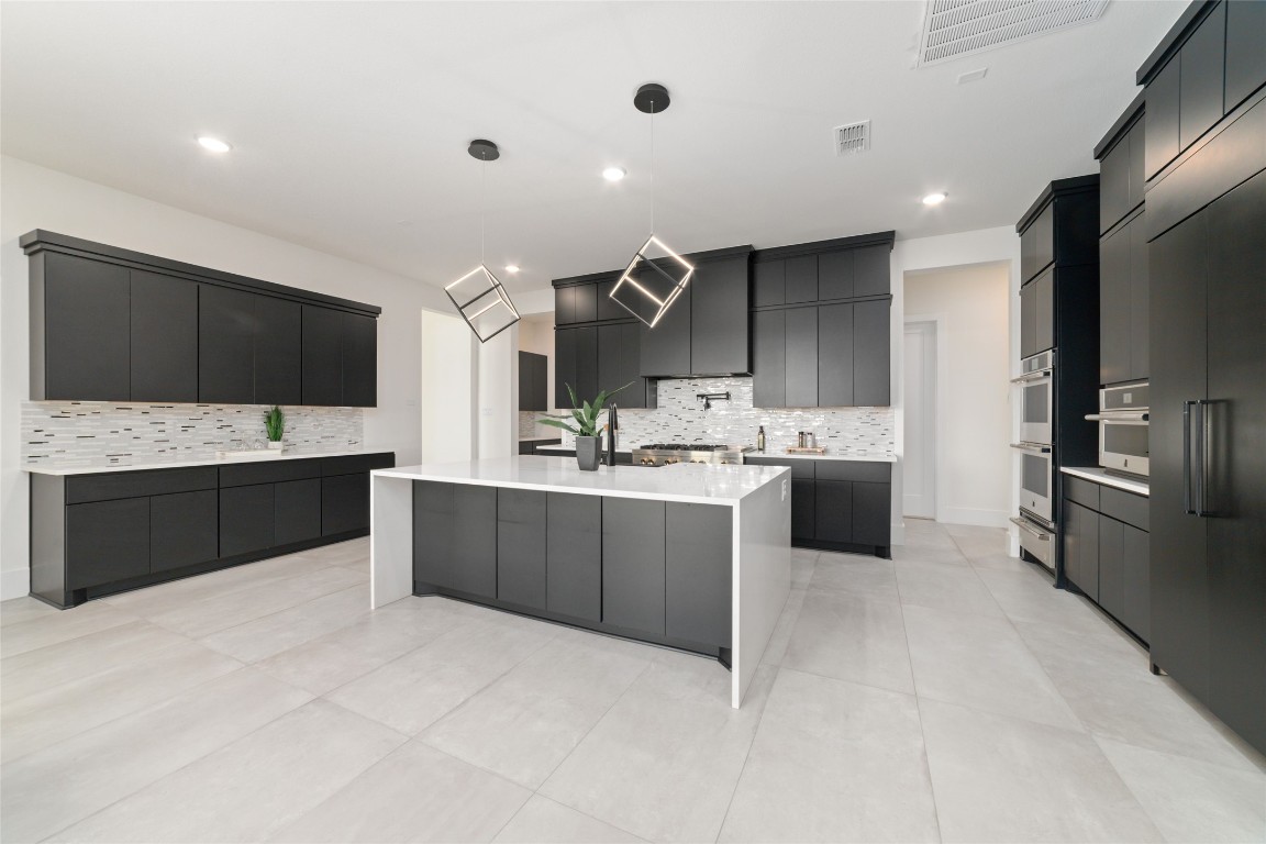 29627 Cir S Rnch Trail Fulshear, TX 77406 - Photo 14 of 50 Kitchen that hits on design and performance. Oversized island, clean lines, no wasted space.