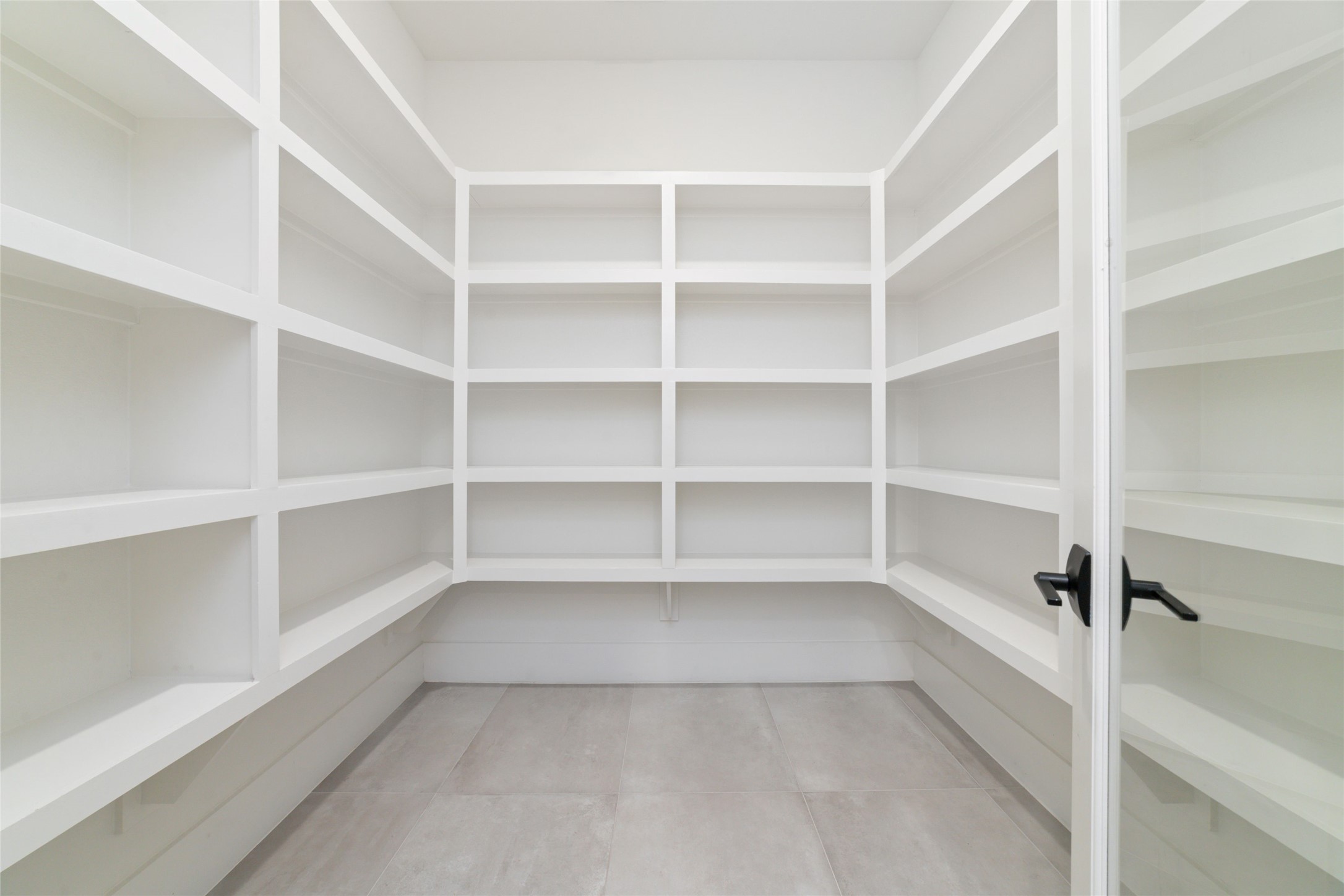 29627 Cir S Rnch Trail Fulshear, TX 77406 - Photo 17 of 50 a view of walk in closet with empty racks