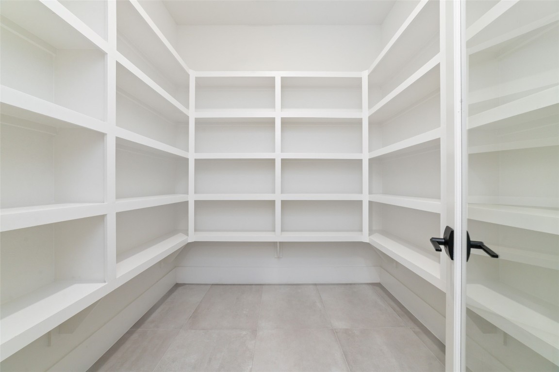 29627 Cir S Rnch Trail Fulshear, TX 77406 - Photo 17 of 50 Oversized walk-in pantry designed to keep the kitchen clean, organized, and always ready to host.