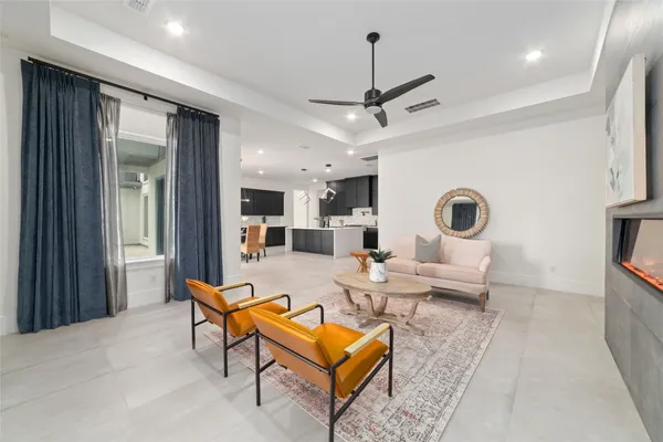 a living room with furniture and a window