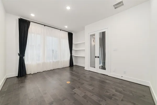 an empty room with closet area
