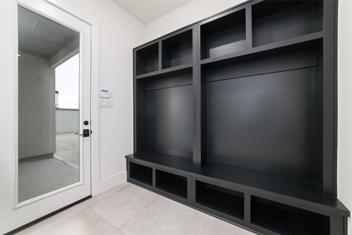 29627 Cir S Rnch Trail Fulshear, TX 77406 - Photo 31 of 50 Custom built-ins thoughtfully integrated to add storage and architectural interest without visual clutter.