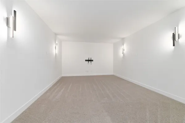 an empty room with a empty space and windows