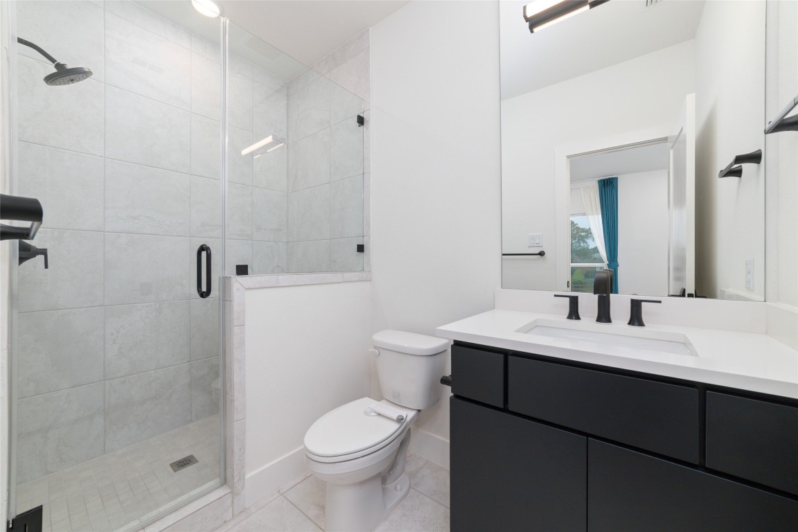 29627 Cir S Rnch Trail Fulshear, TX 77406 - Photo 39 of 50 Ensuite bath continuing the home’s consistent design language with elevated finishes and clean lines.