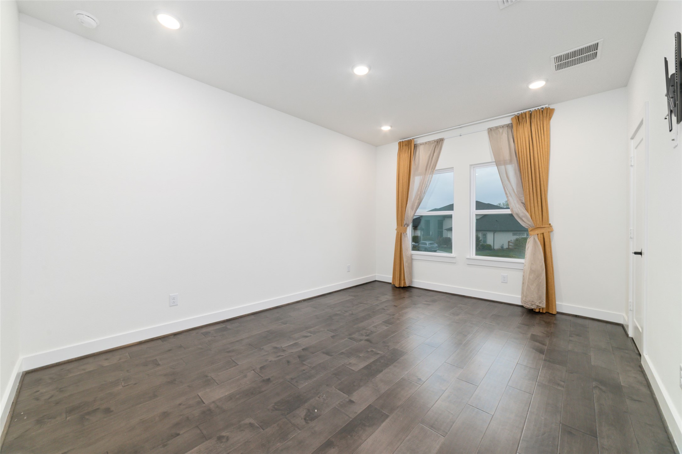 29627 Cir S Rnch Trail Fulshear, TX 77406 - Photo 40 of 50 an empty room with wooden floor and window