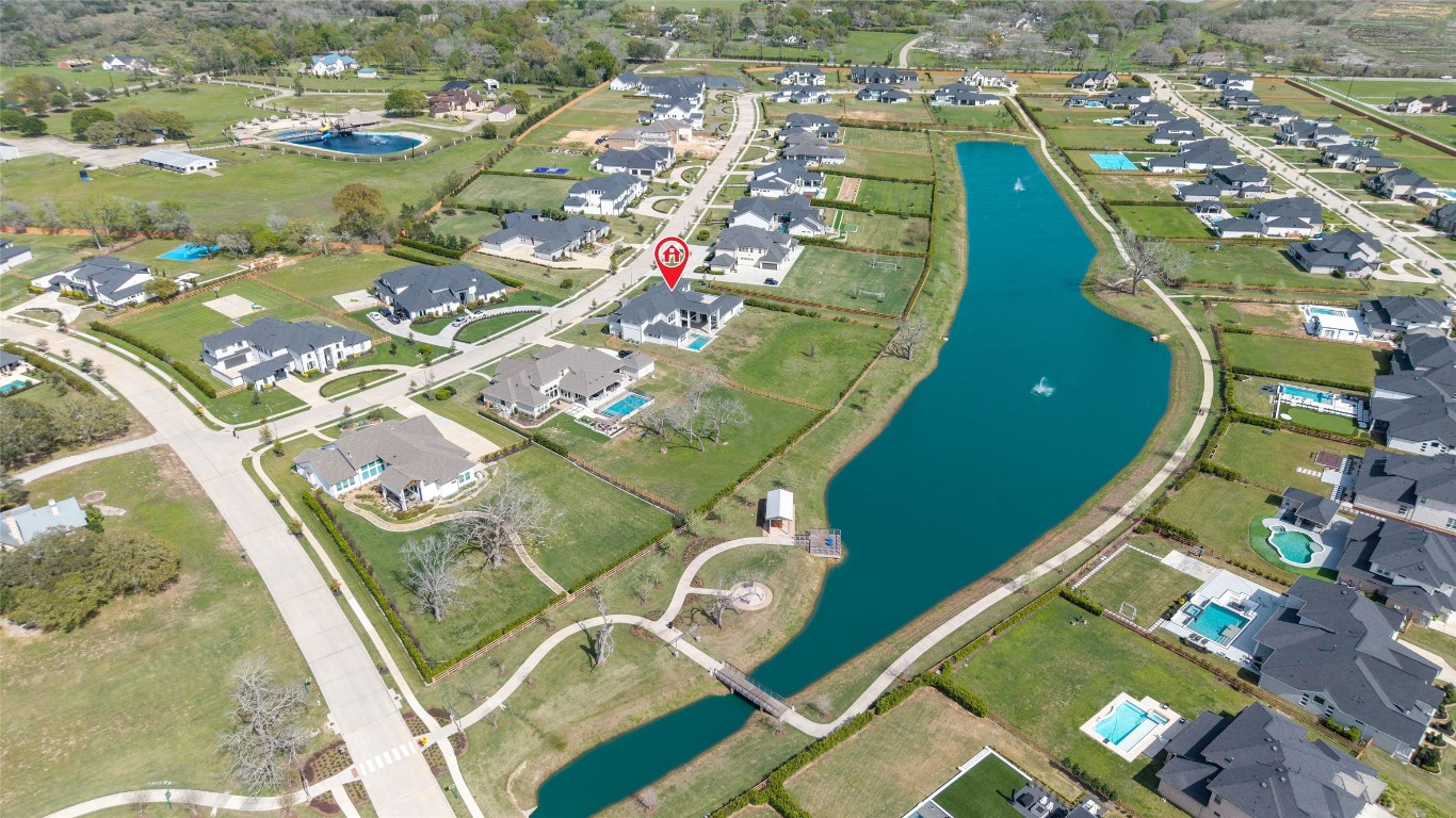 29627 Cir S Rnch Trail Fulshear, TX 77406 - Photo 4 of 50 Aerial view showing what most homes can’t offer… true space, water frontage, and breathing room.