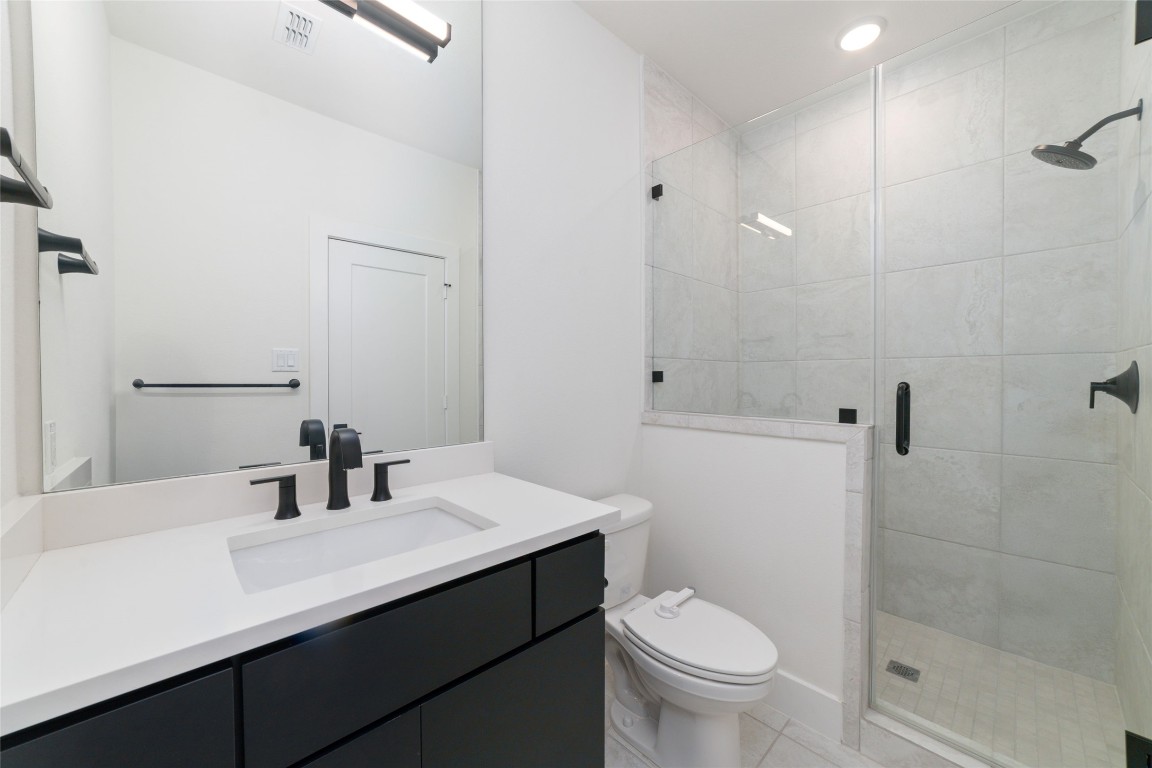 29627 Cir S Rnch Trail Fulshear, TX 77406 - Photo 41 of 50 Bath with glass-enclosed shower and refined detailing, consistent with the home’s overall design.