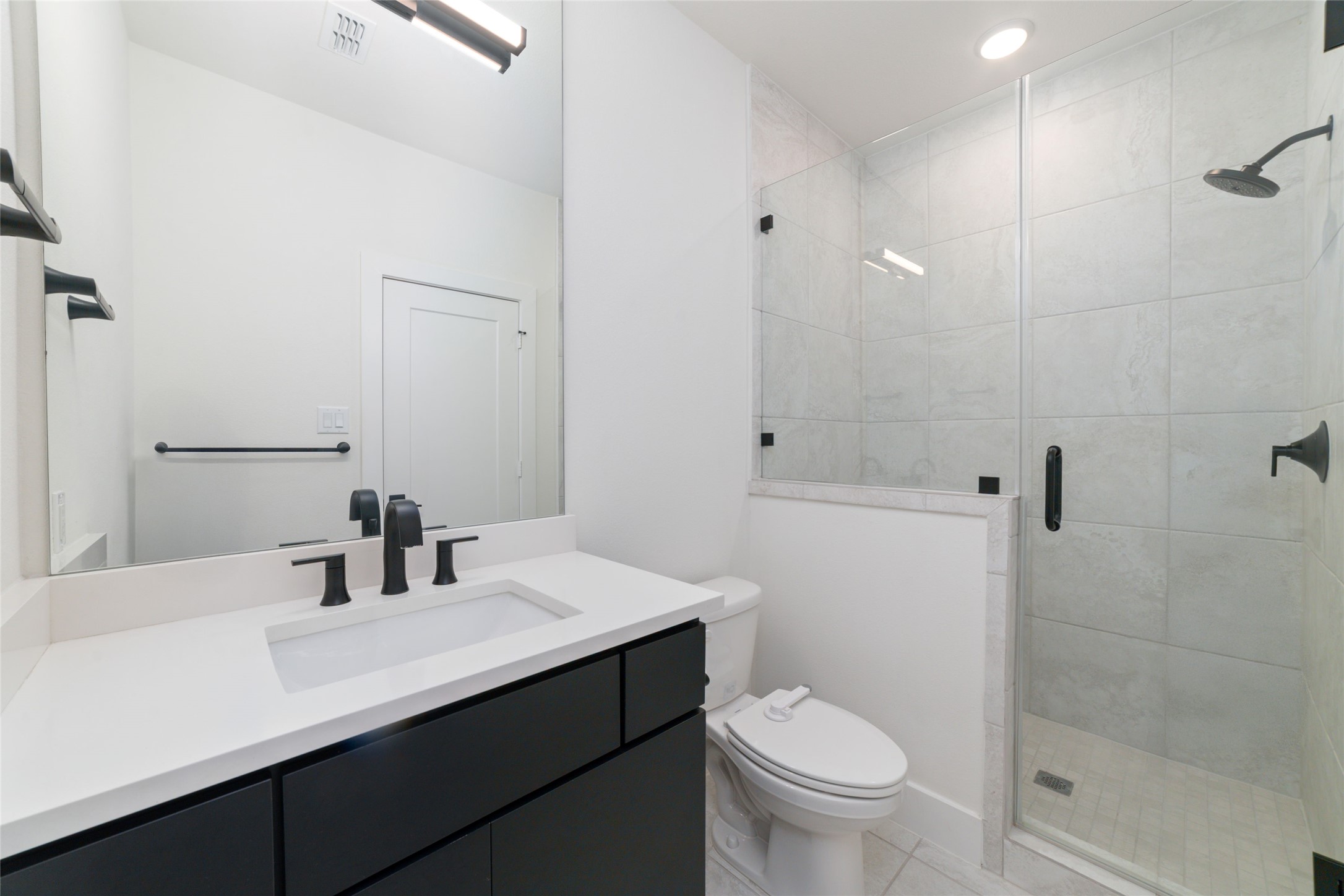 29627 Cir S Rnch Trail Fulshear, TX 77406 - Photo 41 of 50 a bathroom with a sink a toilet and shower