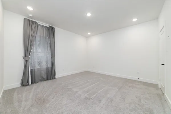 a bathroom with a sink a toilet a shower and a mirror