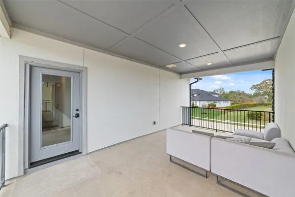 a large kitchen with a sink and cabinets