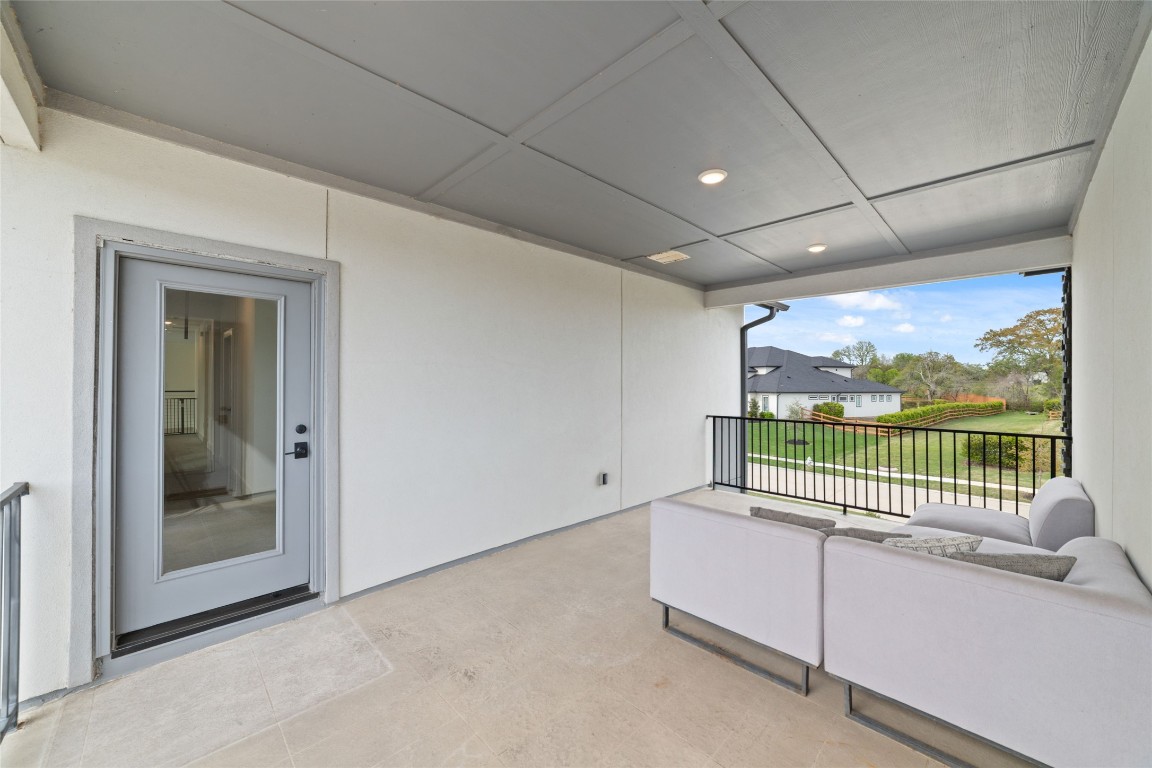 29627 Cir S Rnch Trail Fulshear, TX 77406 - Photo 44 of 50 Covered exterior connection that extends the home’s architecture while maintaining privacy and flow.