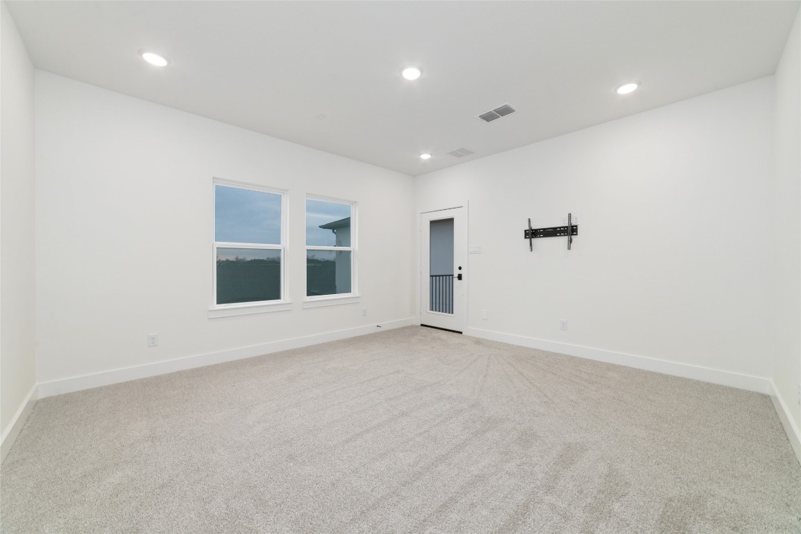 29627 Cir S Rnch Trail Fulshear, TX 77406 - Photo 45 of 50 Flex room positioned across the balcony, creating a separate, intentional space ideal for a gym, additional office, or private retreat.