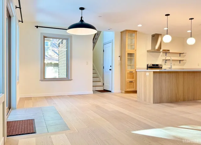 a view of a kitchen with a sink and cabinets