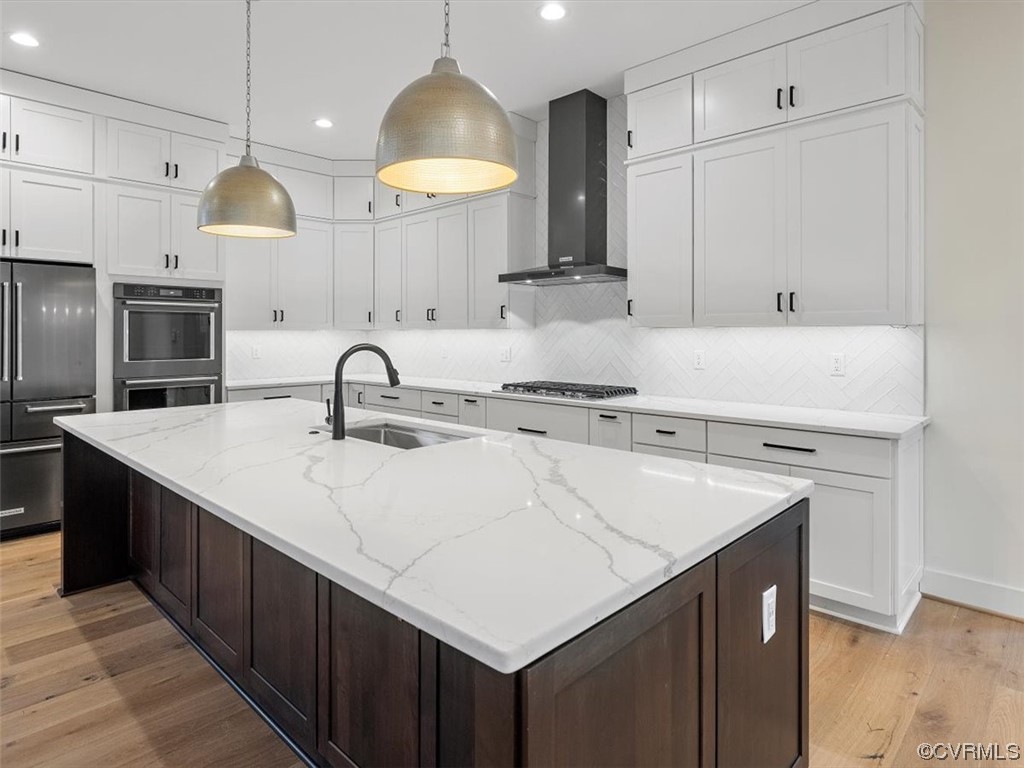 10712 River Fall Path Glen Allen, VA 23059 - Photo 11 of 28 a kitchen with stainless steel appliances a sink a stove a refrigerator and cabinets