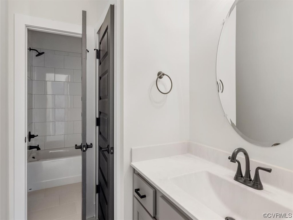 10712 River Fall Path Glen Allen, VA 23059 - Photo 23 of 28 a bathroom with a sink and a mirror