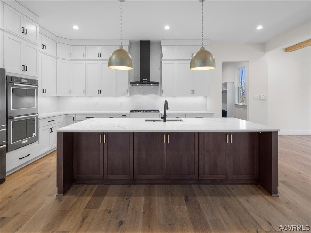 10712 River Fall Path Glen Allen, VA 23059 - Photo 8 of 28 a kitchen with a sink cabinets and wooden floor