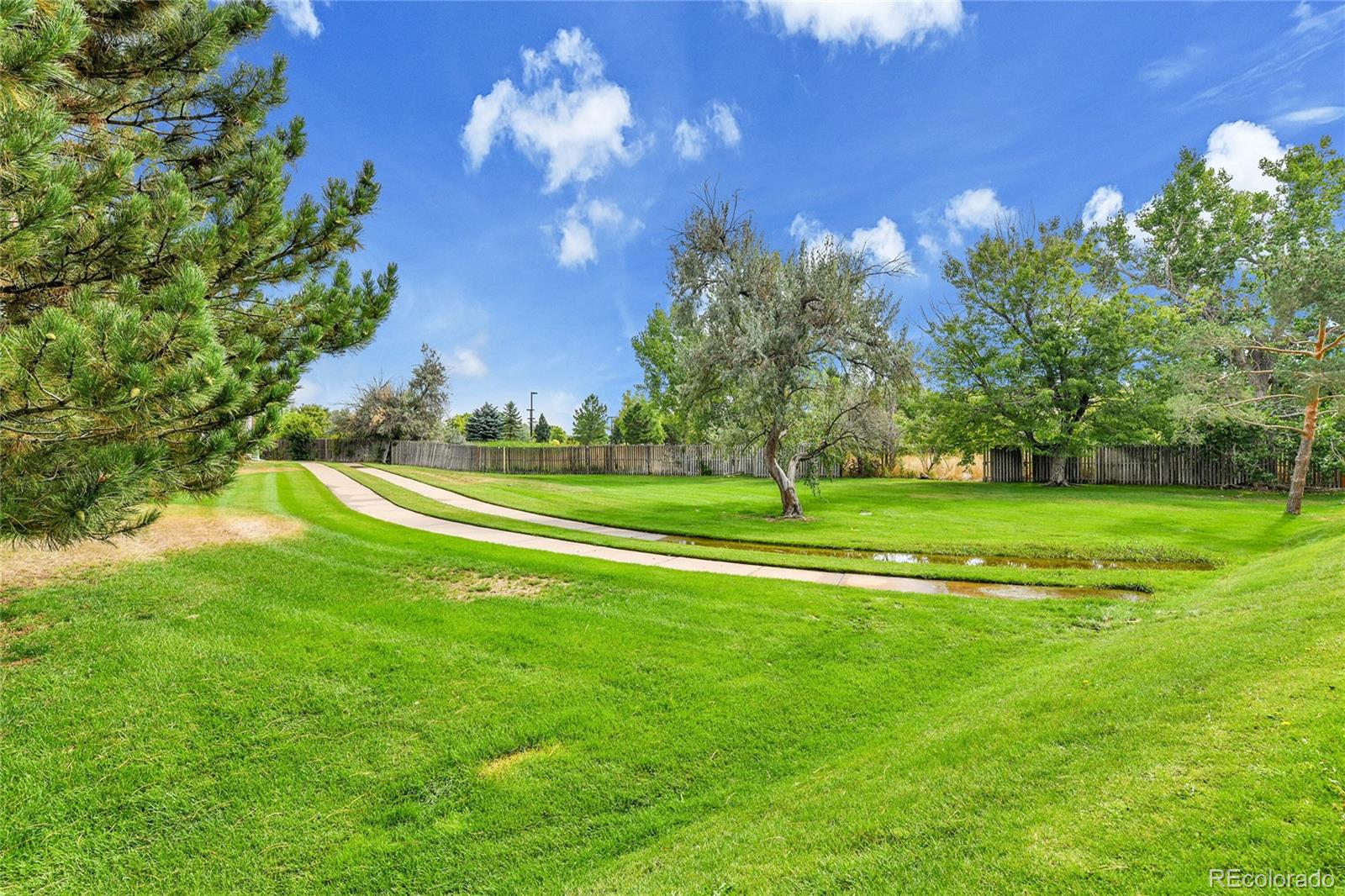 a view of a golf course with a lake