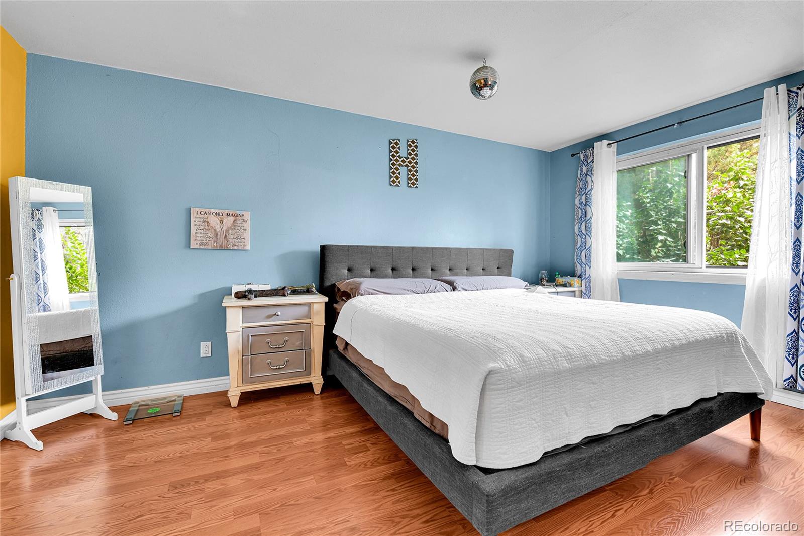 8470 Decatur Street, Unit 80 Westminster, CO 80031 - Photo 13 of 28 a bedroom with a bed and a window