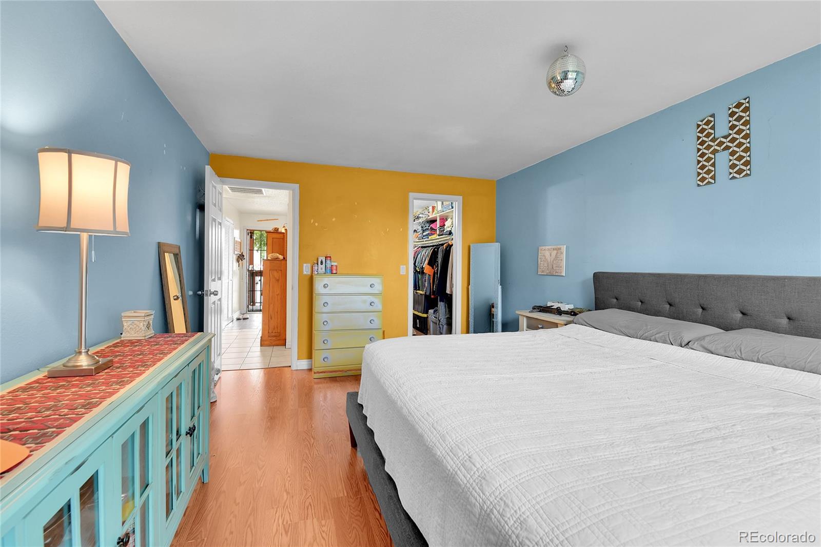 8470 Decatur Street, Unit 80 Westminster, CO 80031 - Photo 14 of 28 a spacious bedroom with a bed and a large mirror