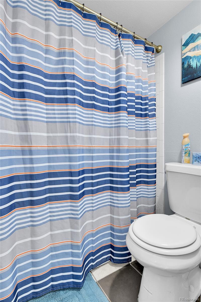 8470 Decatur Street, Unit 80 Westminster, CO 80031 - Photo 20 of 28 a bathroom with a sink and a toilet