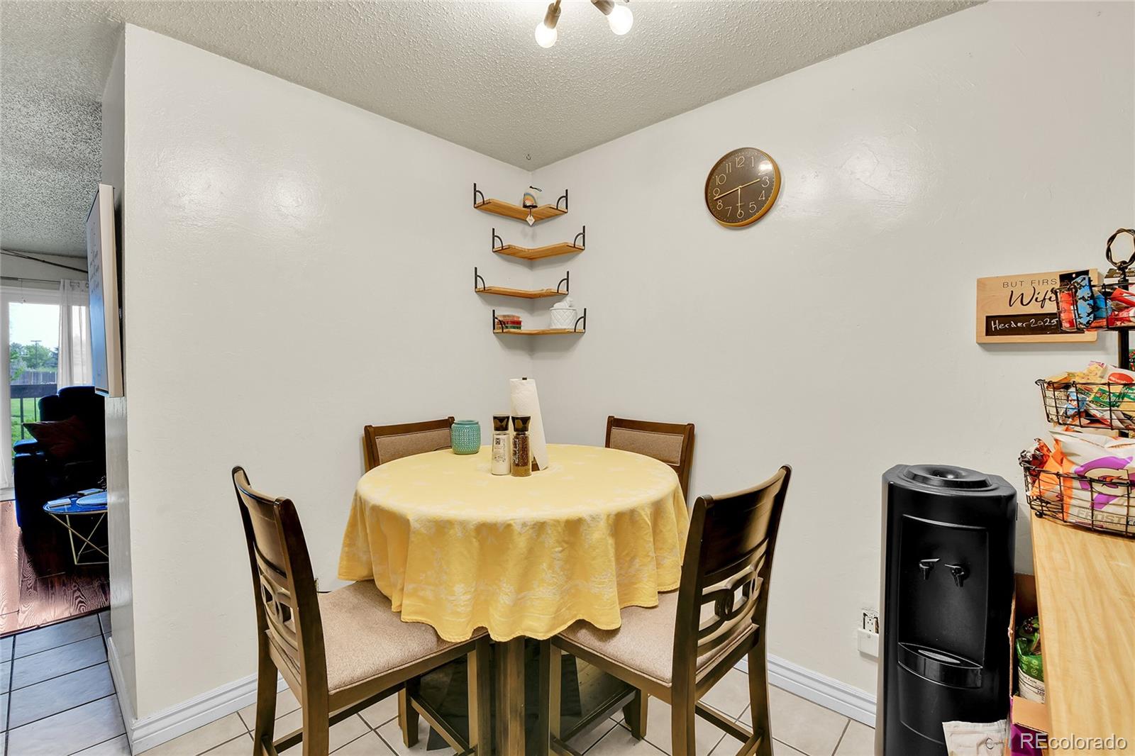 8470 Decatur Street, Unit 80 Westminster, CO 80031 - Photo 2 of 28 a view of a dining room with furniture and wooden floor