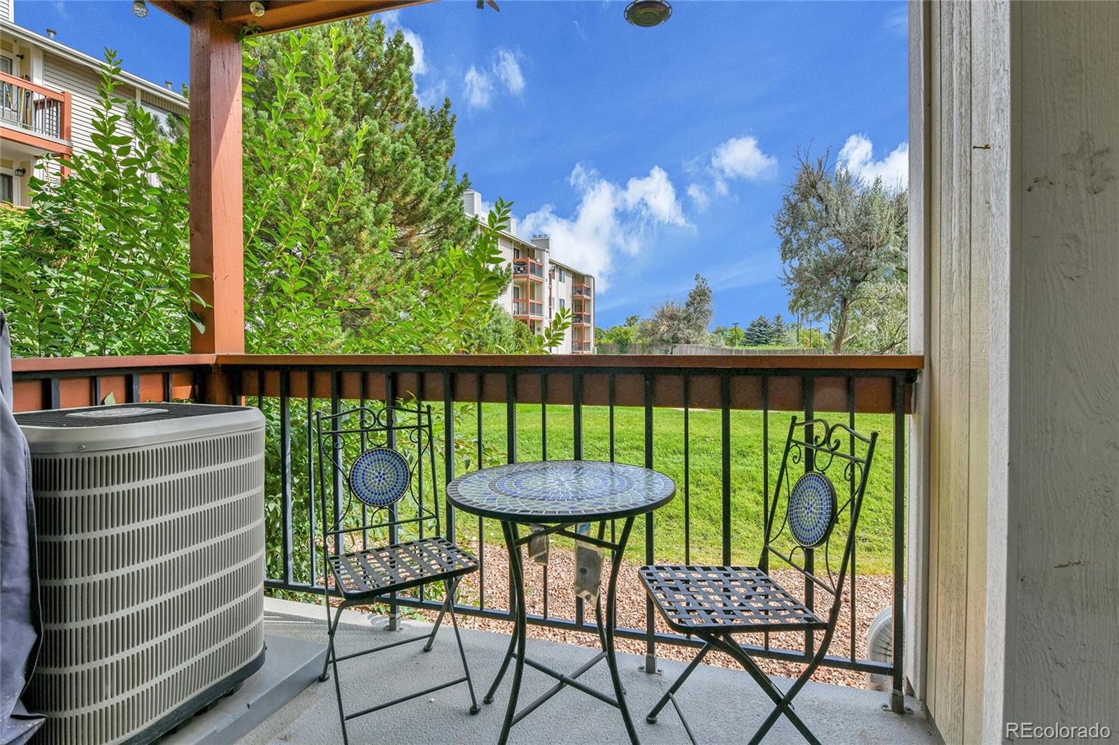 8470 Decatur Street, Unit 80 Westminster, CO 80031 - Photo 22 of 28 a view of a chairs and table in the balcony