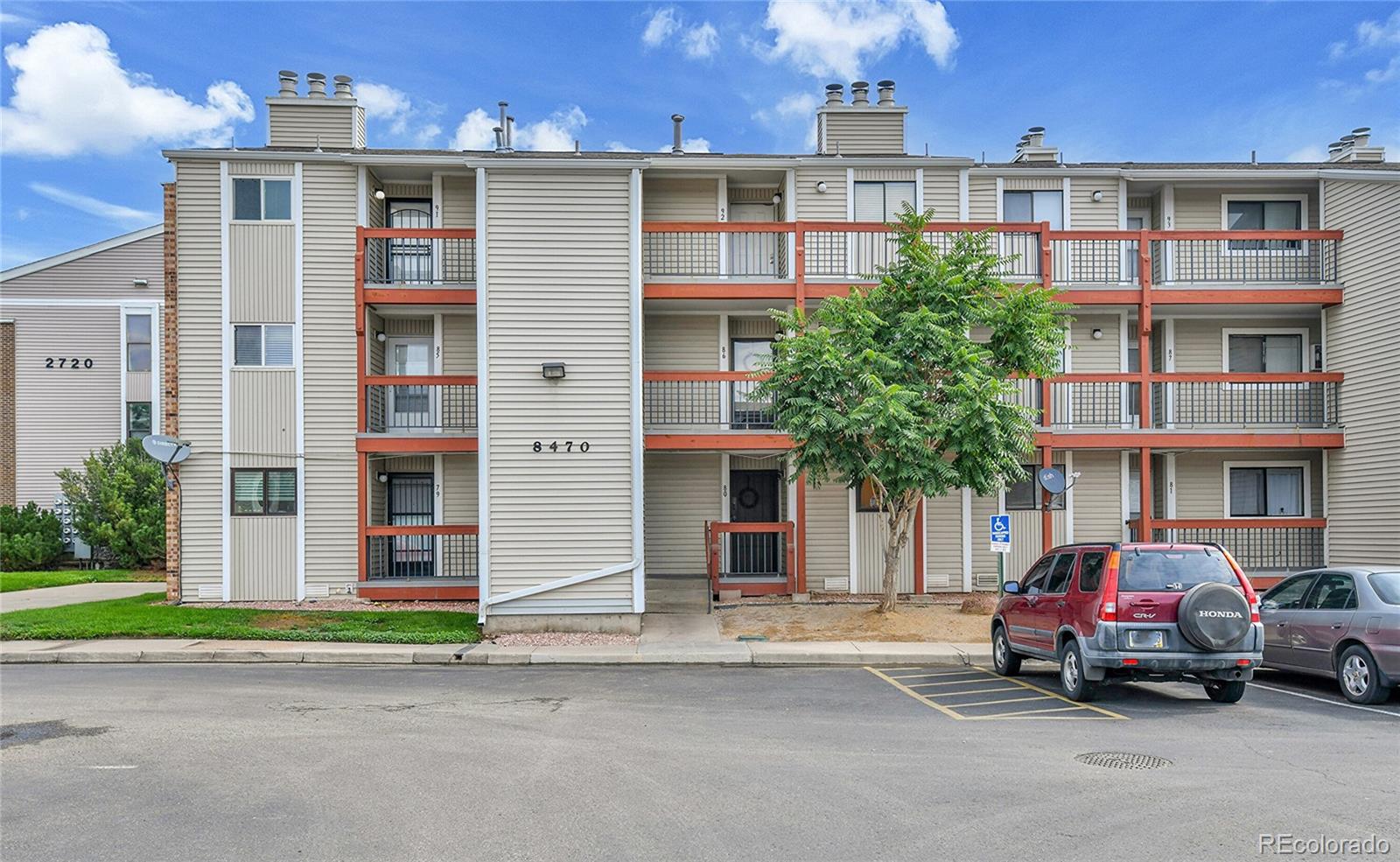 8470 Decatur Street, Unit 80 Westminster, CO 80031 - Photo 26 of 28 a car parked in front of a building