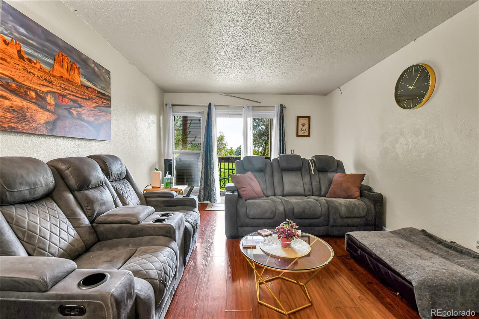 8470 Decatur Street, Unit 80 Westminster, CO 80031 - Photo 10 of 28 a living room with furniture and a wooden floor