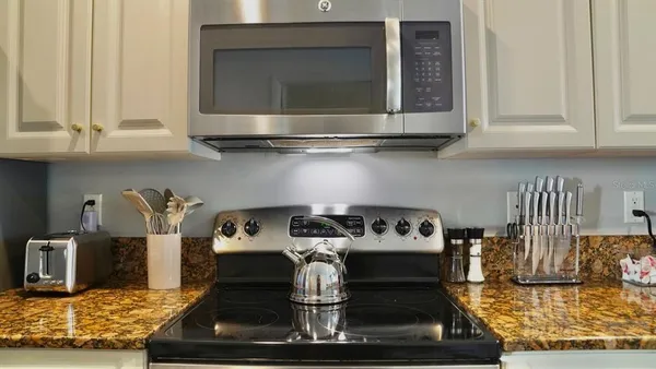 a kitchen with a stove and a microwave