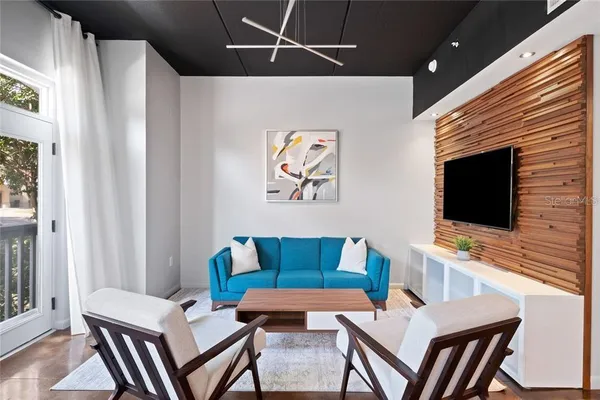 a living room with furniture and a flat screen tv