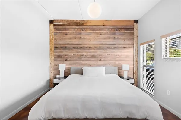 a bedroom with a bed and a table