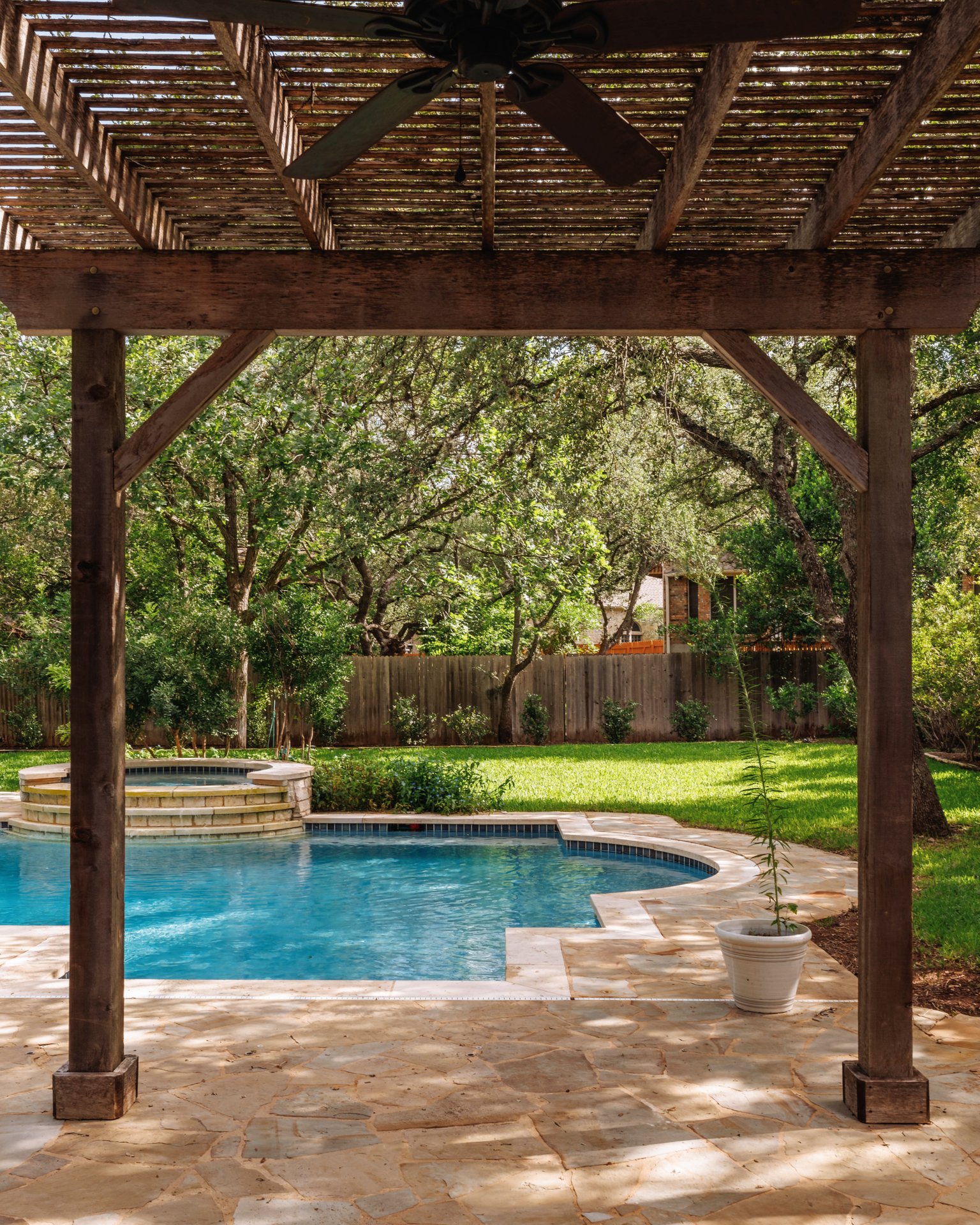 5512 Ballenton Lane Austin, TX 78739 - Photo 36 of 40 An inviting pool and spa, shaded by a wooden pergola, anchors this private, verdant backyard.
