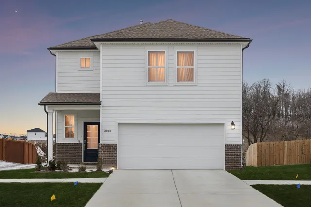 a front view of a house with yard