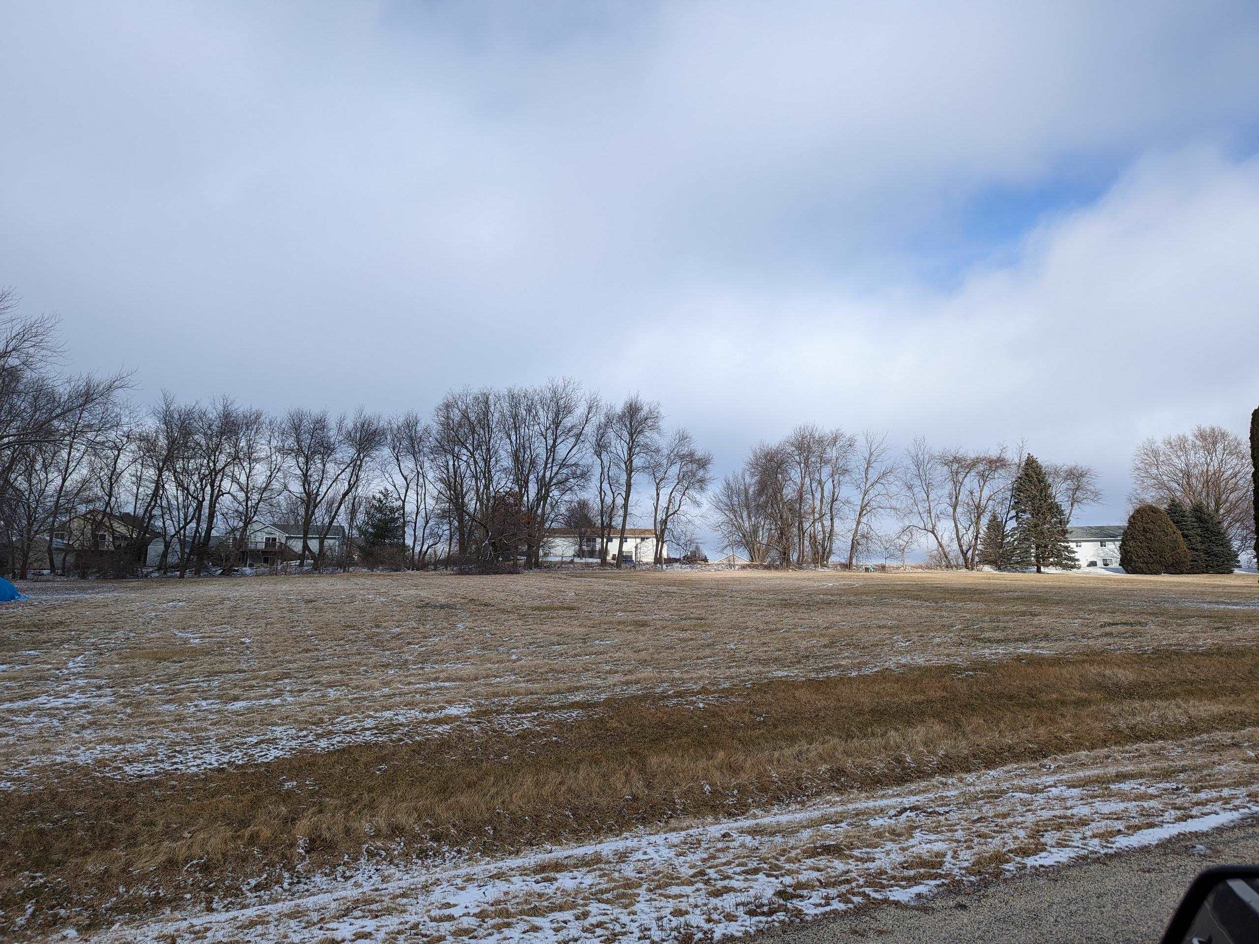 a view of an outdoor space and covered with trees
