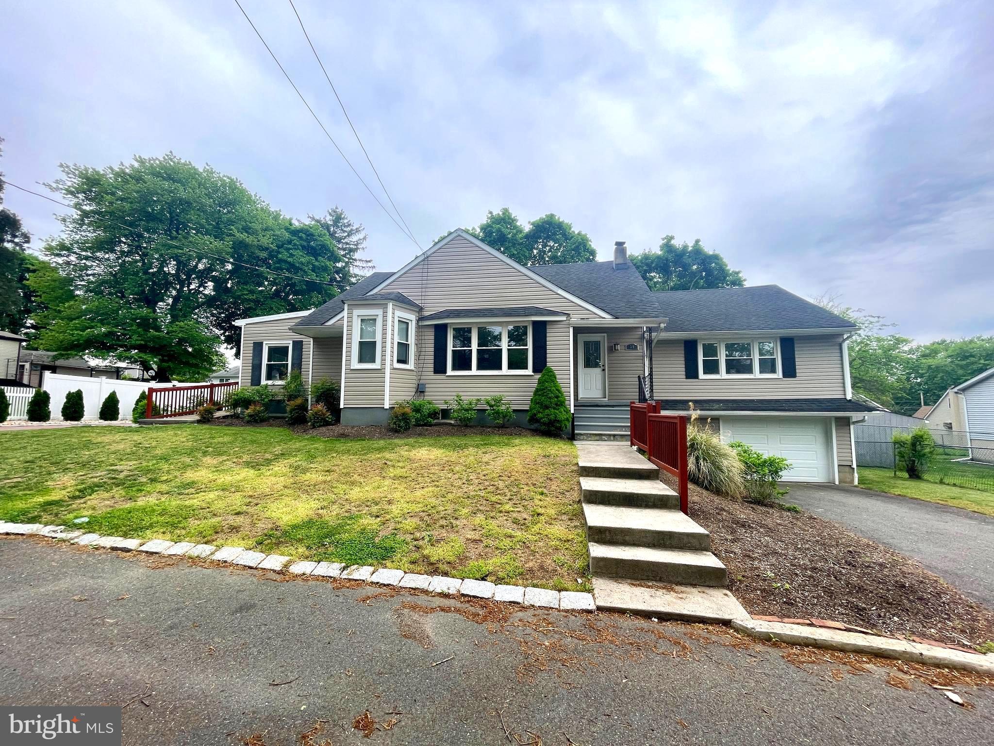 39 Mabel Street Ewing, NJ 08638 - Photo 1 of 33 a front view of a house with a garden