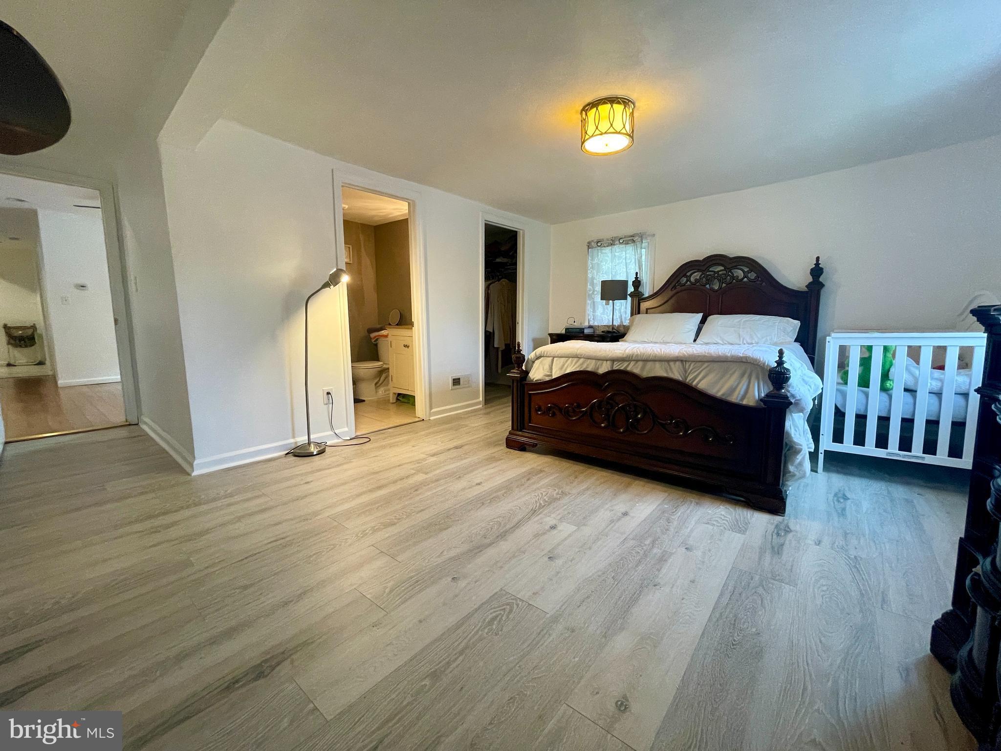 39 Mabel Street Ewing, NJ 08638 - Photo 11 of 33 a spacious bedroom with a bed and a walk in closet