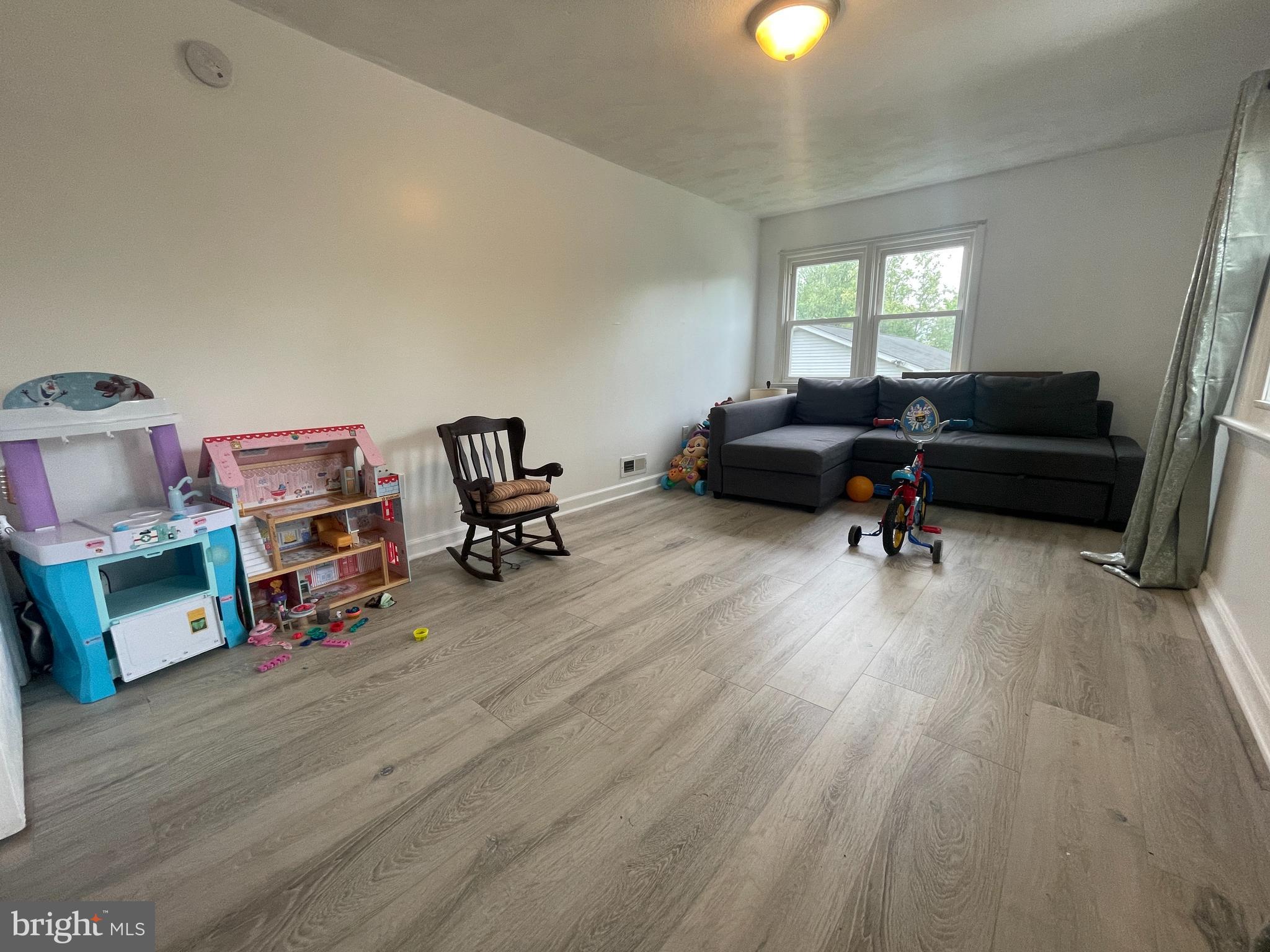 39 Mabel Street Ewing, NJ 08638 - Photo 13 of 33 a living room with furniture and a wooden floor