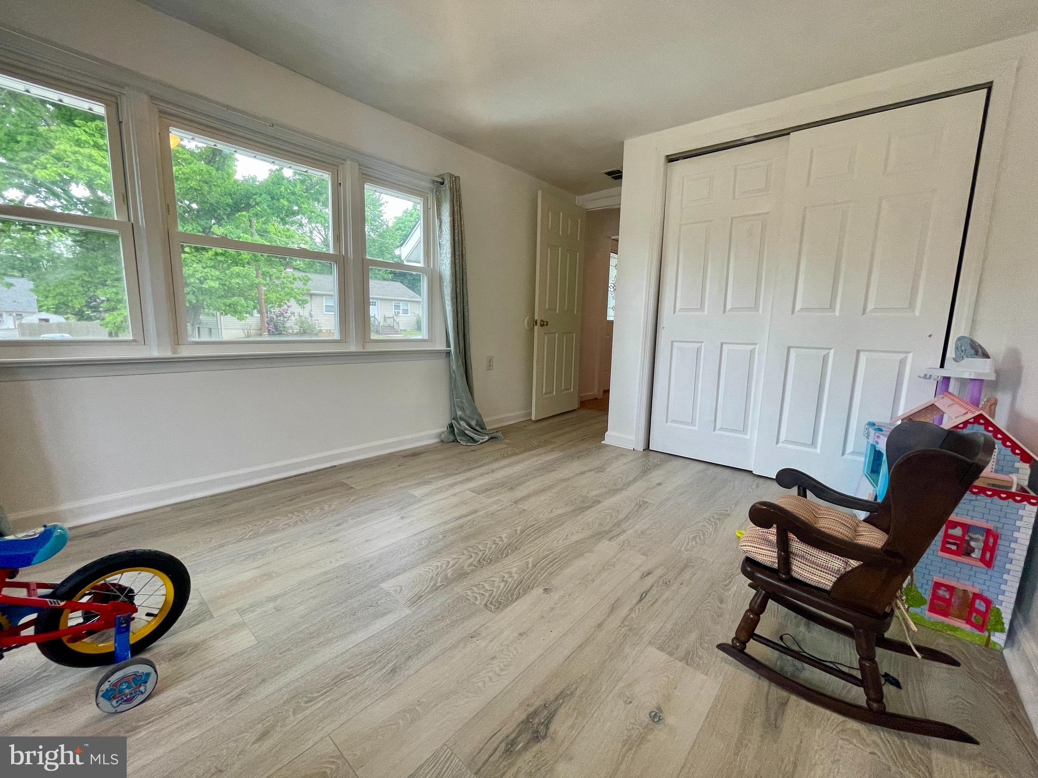 39 Mabel Street Ewing, NJ 08638 - Photo 14 of 33 a view of a room with wooden floor gym equipment and windows
