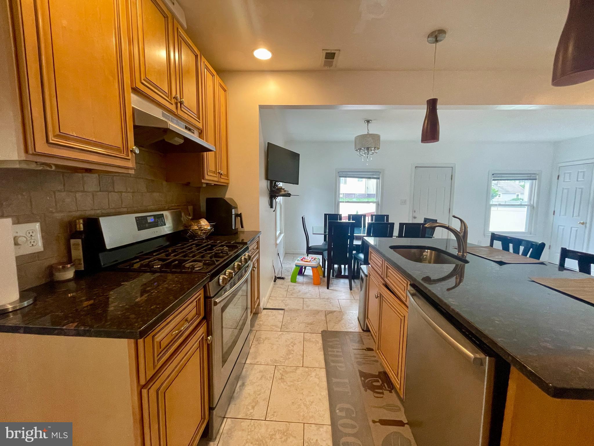 39 Mabel Street Ewing, NJ 08638 - Photo 20 of 33 a kitchen with stainless steel appliances granite countertop a stove and a sink