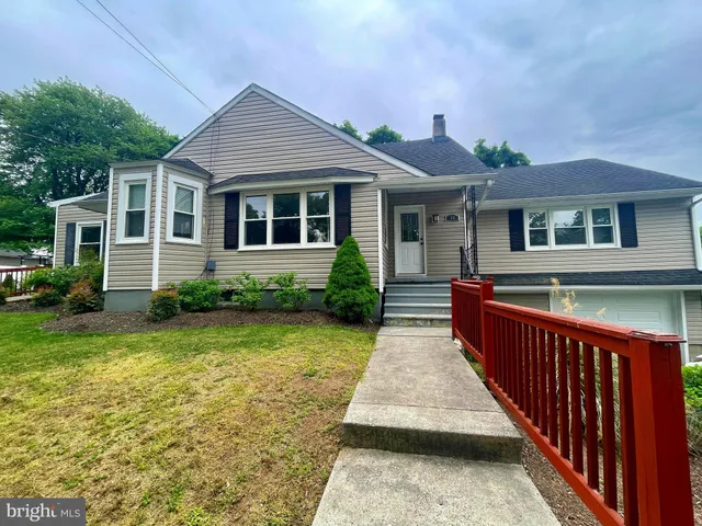 a front view of a house with yard