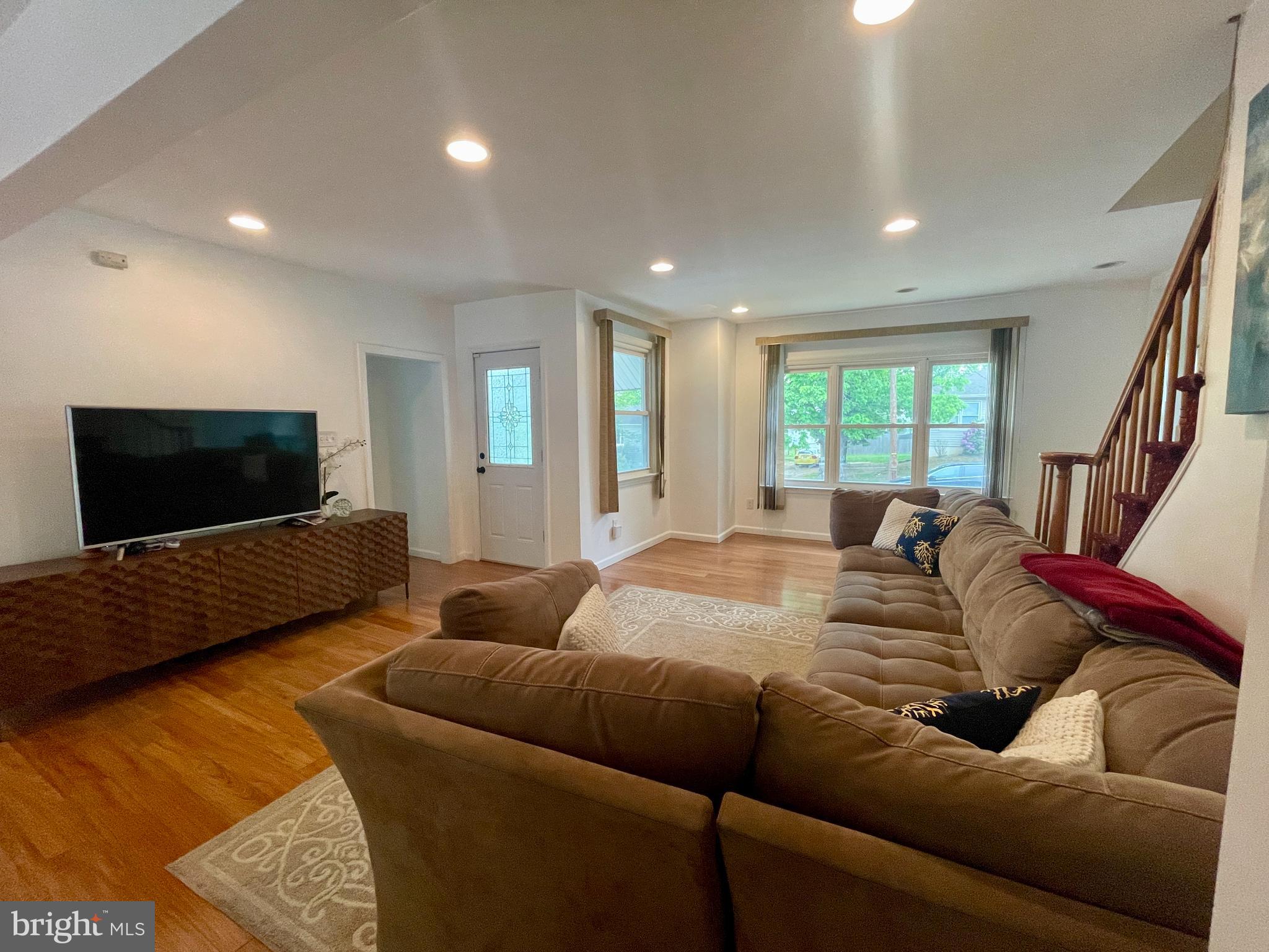 39 Mabel Street Ewing, NJ 08638 - Photo 5 of 33 a living room with furniture and a flat screen tv