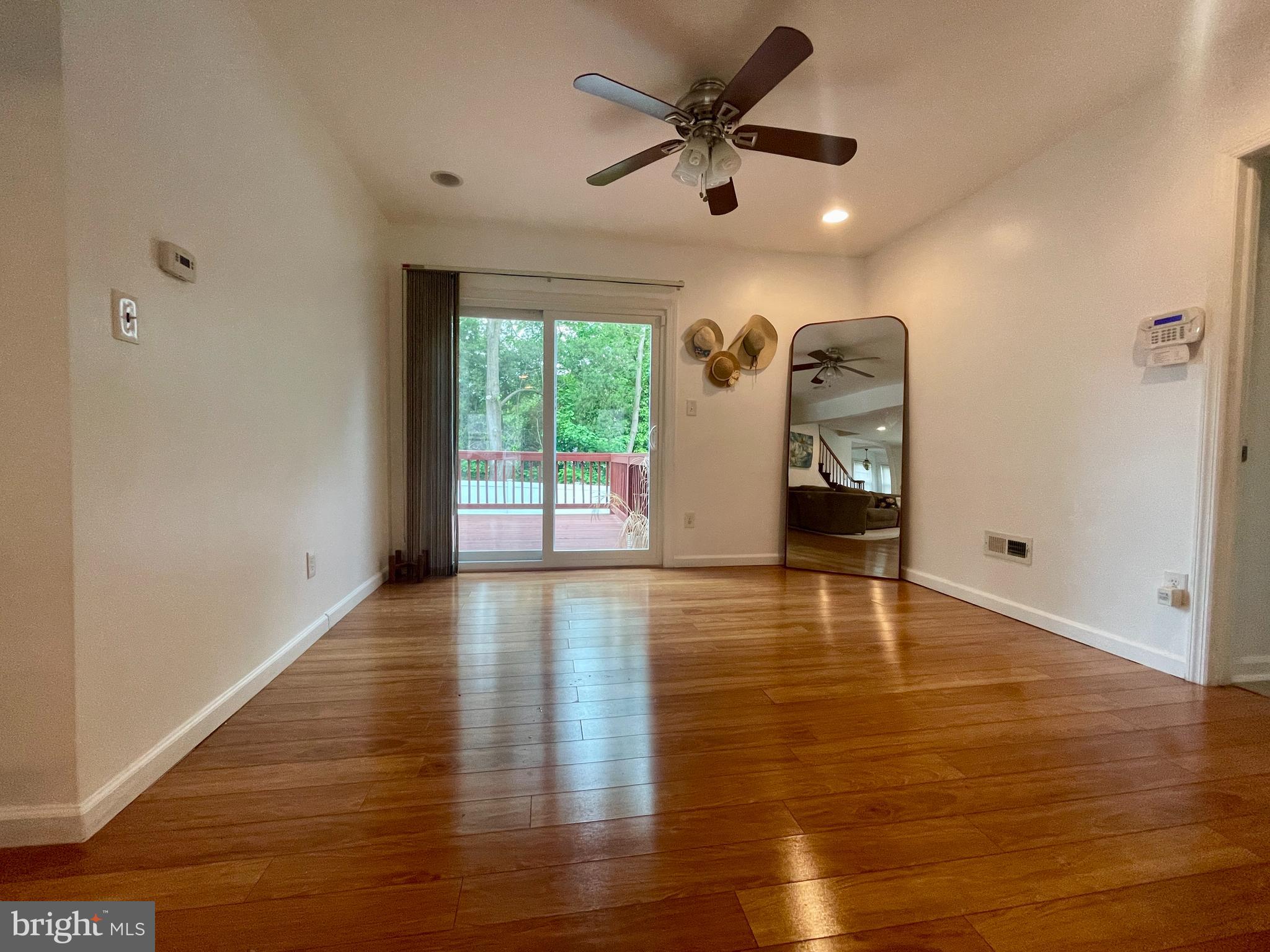 39 Mabel Street Ewing, NJ 08638 - Photo 6 of 33 a view of a livingroom with a ceiling fan and hardwood floor